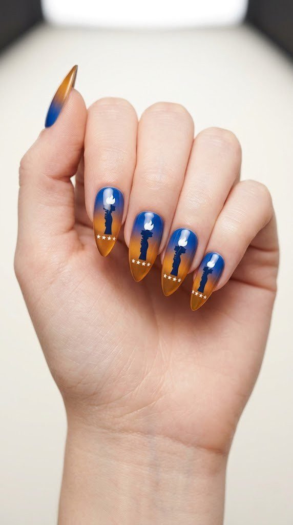 patriotic 4th of july nails with statue of liberty silhouette on royal blue to amber gradient