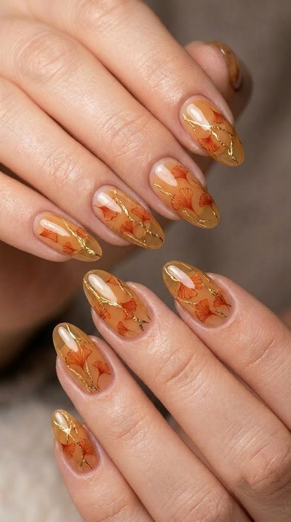 Harvest gilding fall nail ideas with gold leaf veining on almond nails