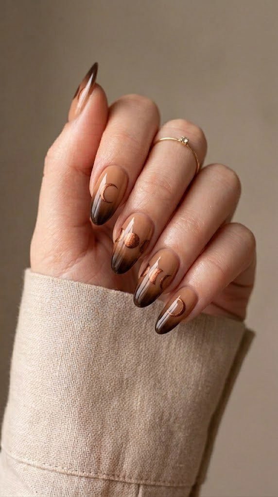 caramel to espresso ombre nails with copper metallic solar eclipse micro-illustrations