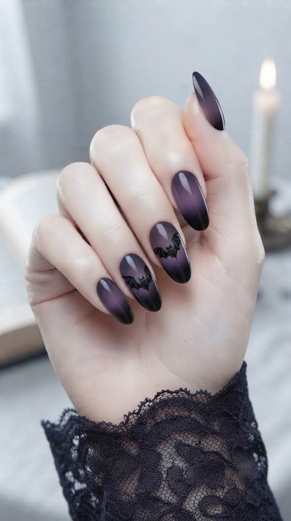gothic vampire nails with a black bat painted in matte finish