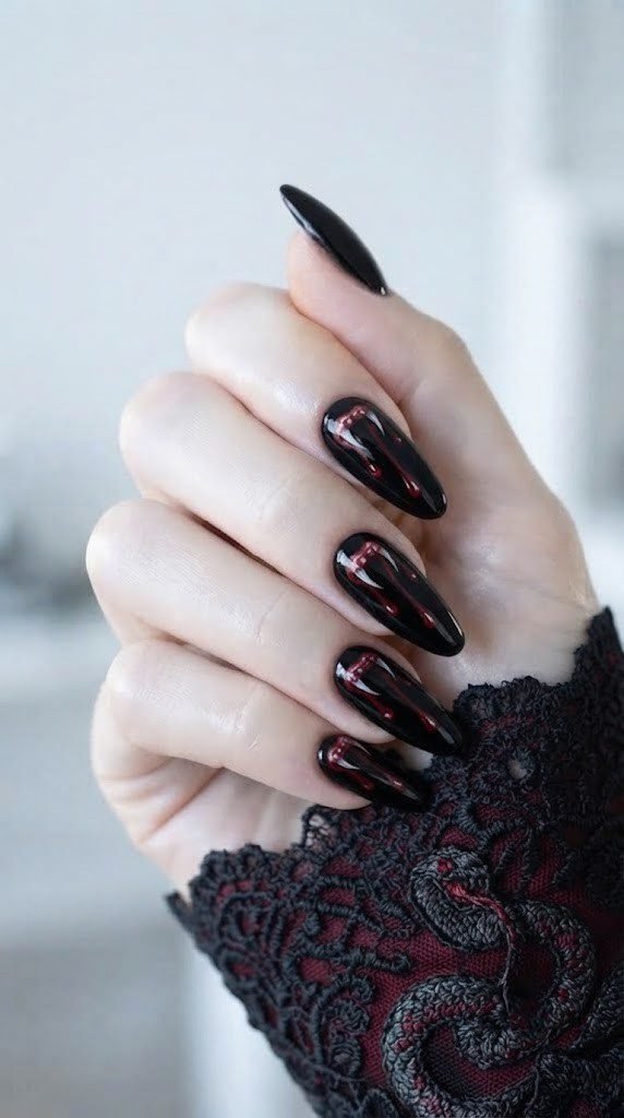 gothic halloween nails with snake fang bite marks and venom drips