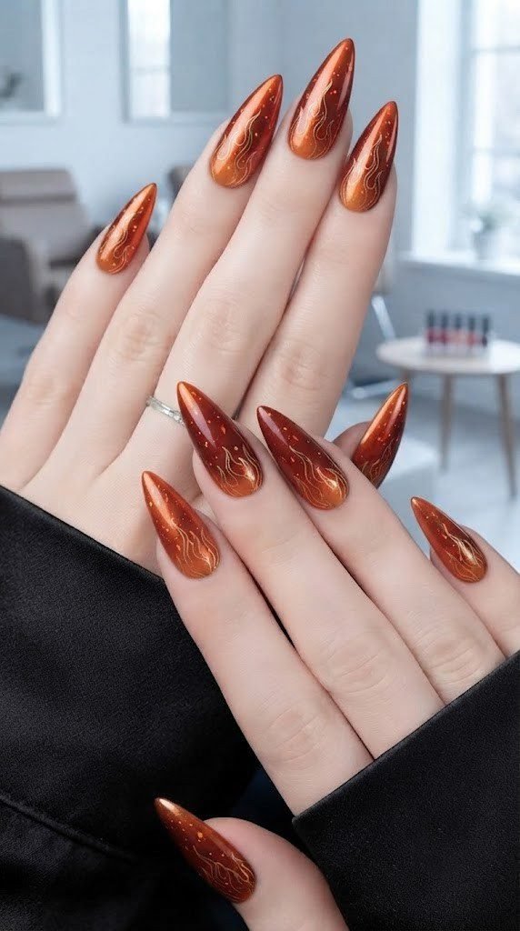 fall stiletto nails in rust ombre with gold ember flame detail