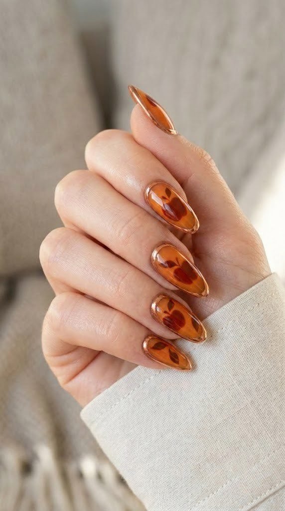 Spiced cider almond nails with orchard leaves circled in rose gold chrome