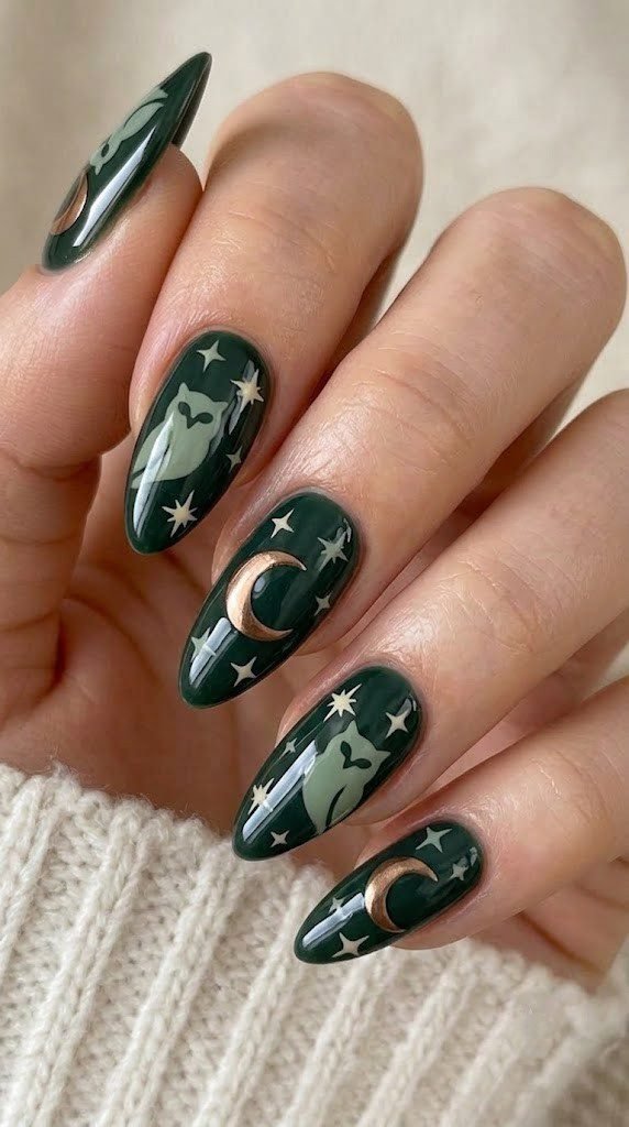 Almond nails in dark forest green with an owl silhouette and bronze chrome moon