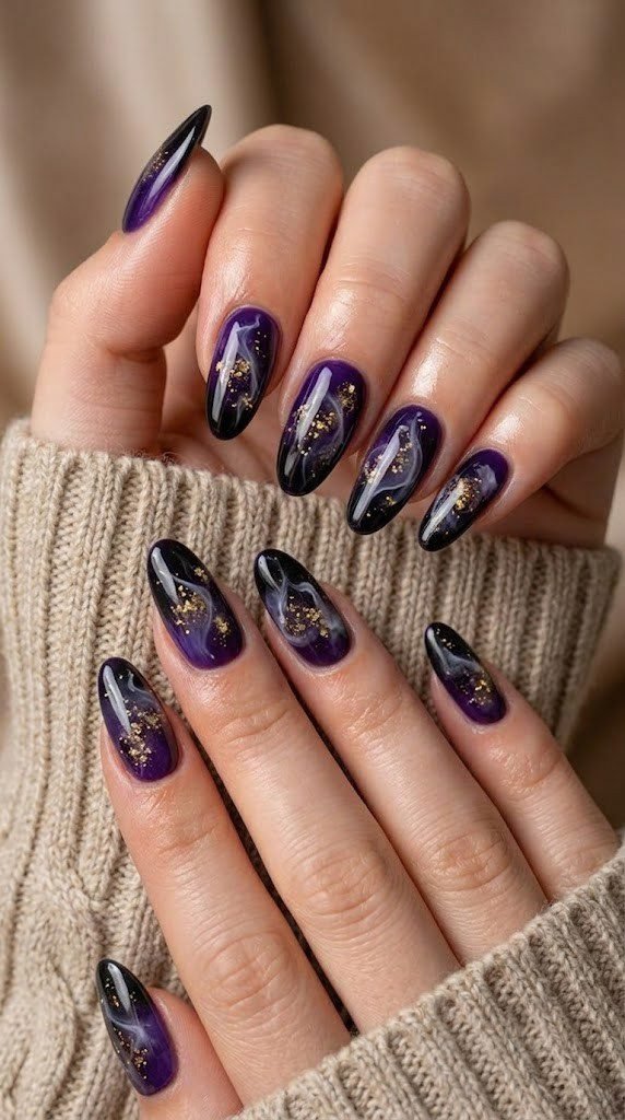 Violet and black fall almond nails with a glowing gold spore design
