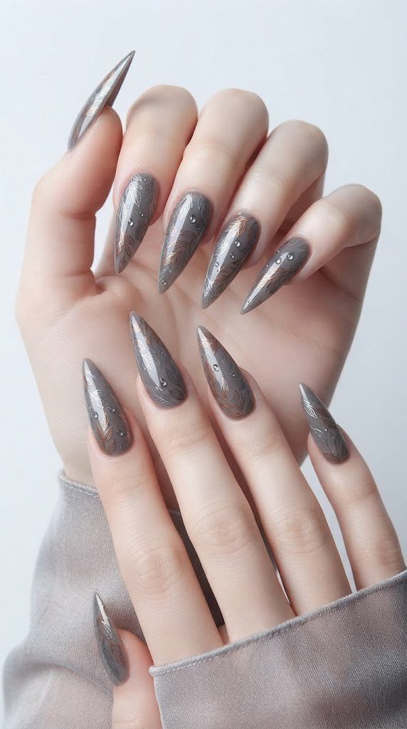 chrome stiletto nails in slate brown with scattered leaf detail