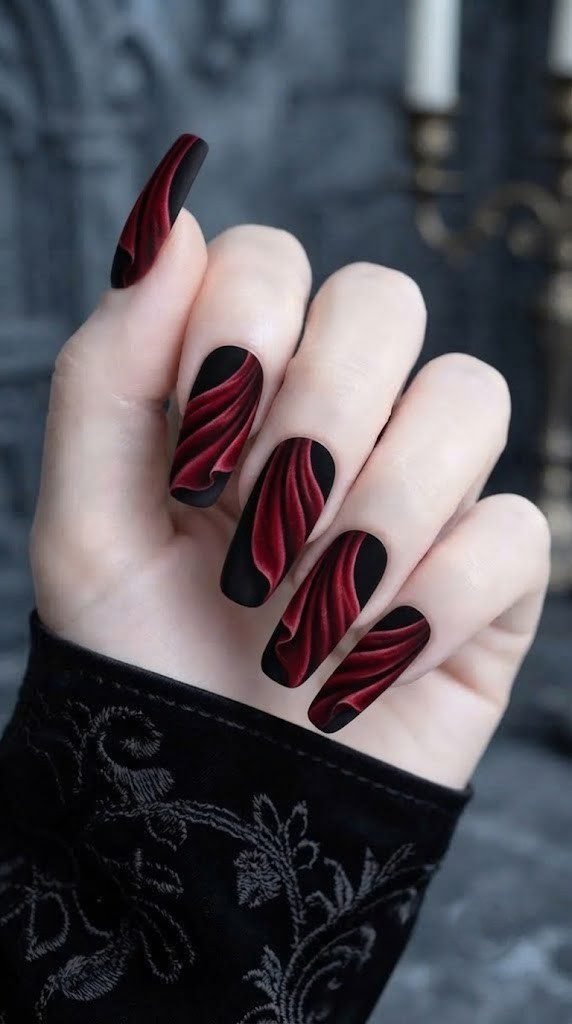 dramatic nail designs painted like a flowing velvet vampire cape
