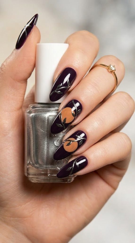 Midnight plum almond nails featuring a harvest moon wrapped in gunmetal chrome