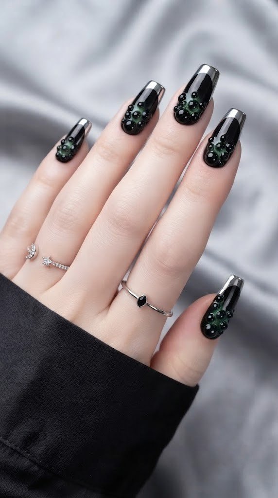 Bubbling witch cauldron black Halloween nails with an eerie green glow