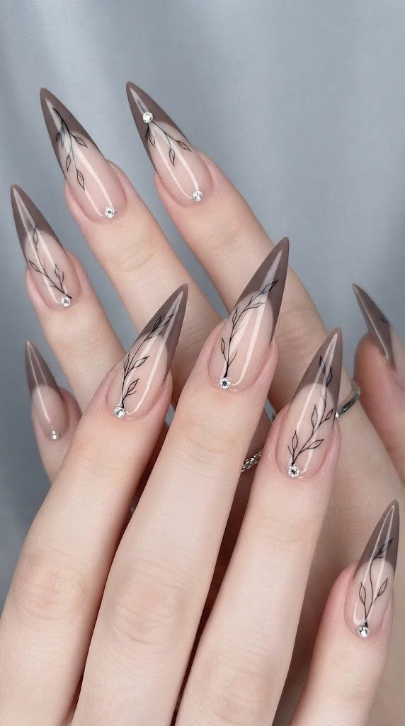long stiletto nails in taupe color block with bare branch linework