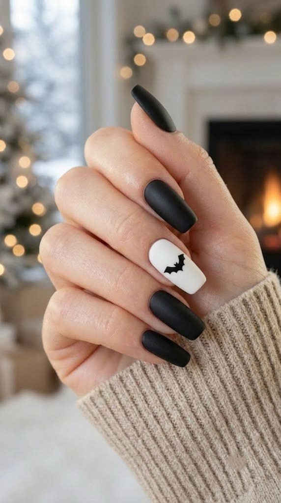 Minimal short square Halloween nails with a single bat accent nail