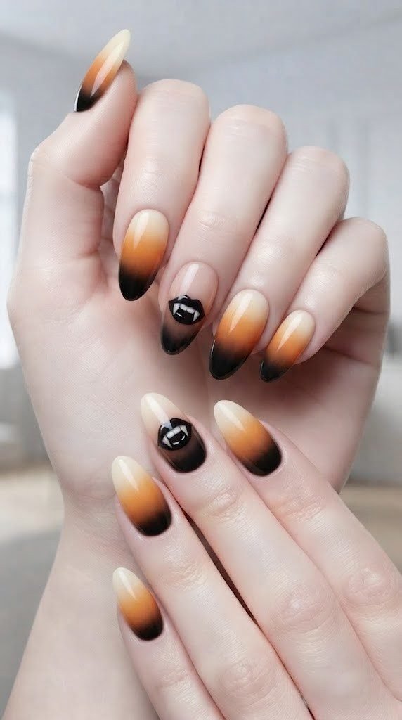 Acrylic Halloween nail designs with candy corn ombré and a vampire fang accent