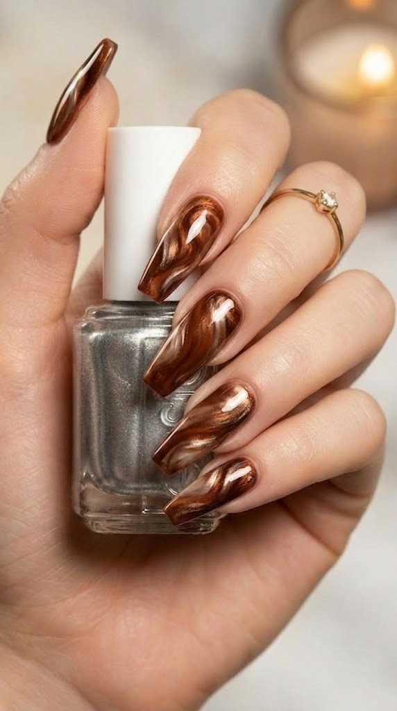 Cinnamon brown and bronze molten swirl nails with high shine cream resin accents