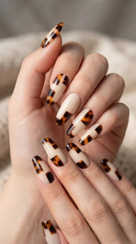 Cream base fall nail design with dark amber tortoiseshell print blocks