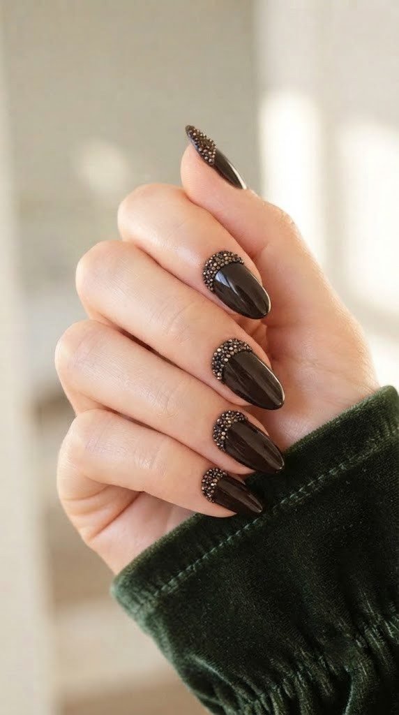 Glossy espresso almond nails with bronze crystal detail, standout september nails