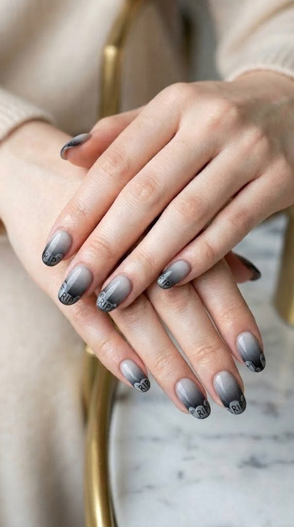 Foggy grey-black tombstone ombre design on short Halloween nails with RIP lettering