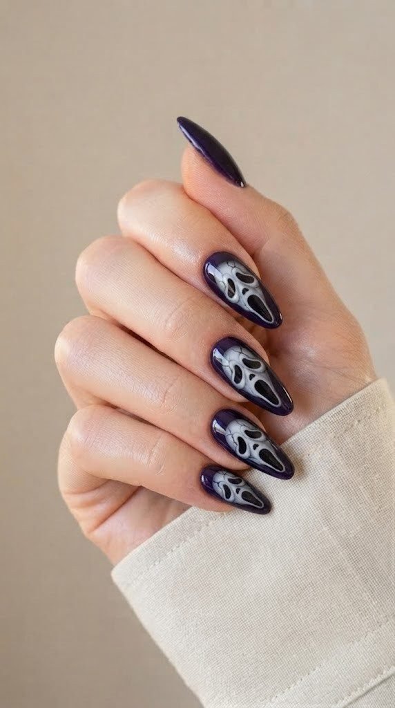 Midnight-purple halloween nail art with cracked vintage masks