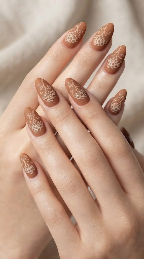 Toasted cinnamon almond nails with an ivory rowan berry line sketch