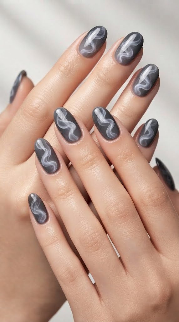 Charcoal grey oval nails with pearlescent smoke wisp gradient finish"
