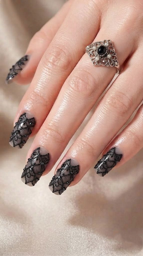 Smoky grey nails with black lace veil detailing, a gothic Halloween nail design