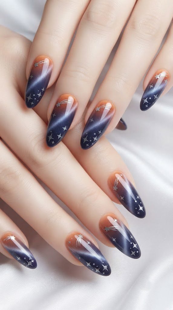 Almond fall nails showing a starry equinox sky fading into deep indigo